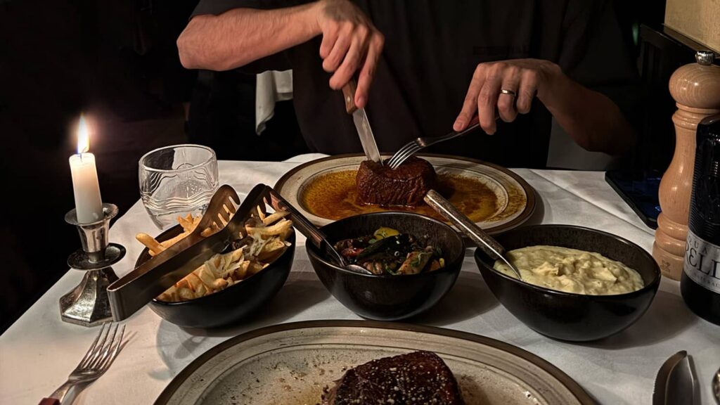 Couple enjoying a romantic candlelit dinner, reflecting meaningful connections and modern dating experiences