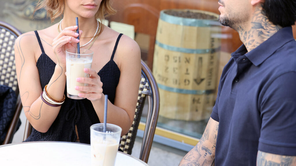 Iranian couple meeting for a first date at a cafe in Germany