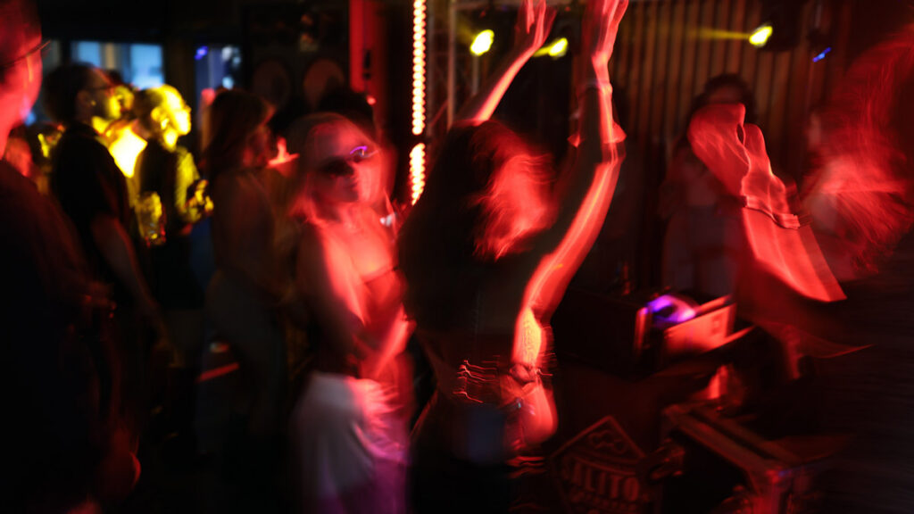 People dancing at an Iranian community event in the diaspora