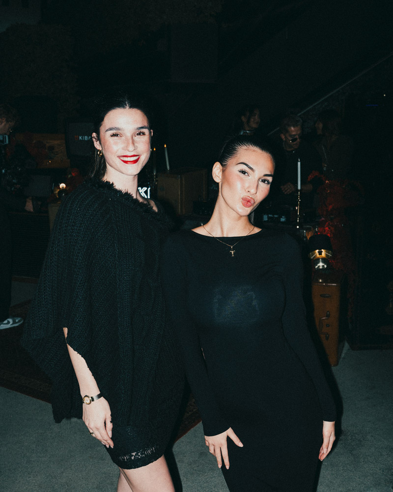 Two guests posing together at the KIBAKI launch party