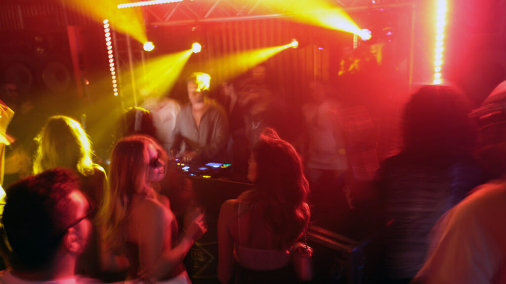 People dressed up and enjoying music at a social event