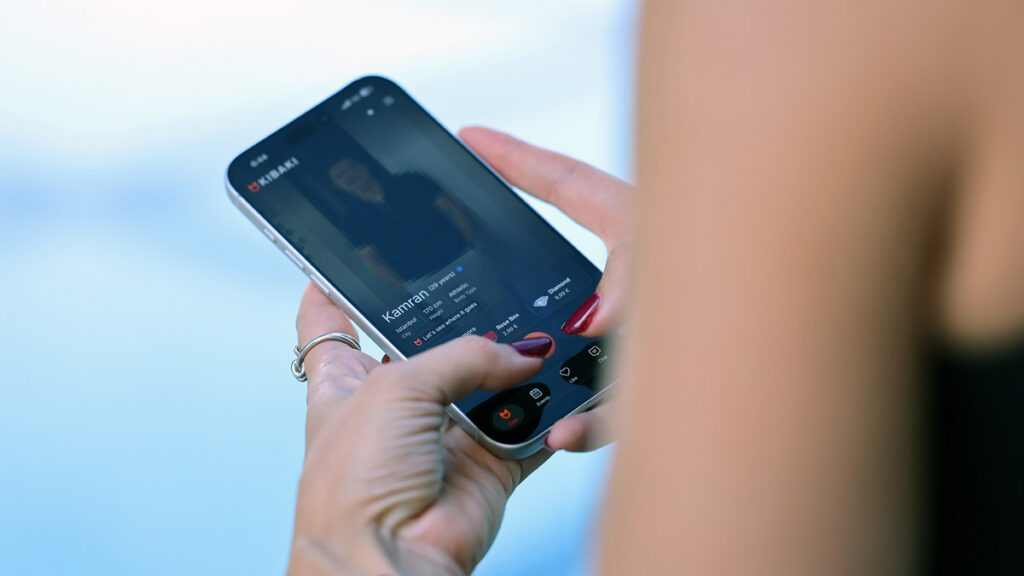 Woman browsing a profile on a Persian dating app