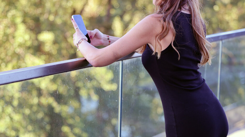 Woman using the KIBAKI app to find Persian events nearby