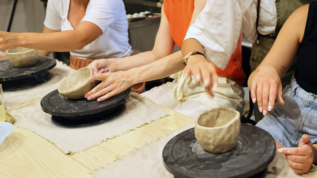 Group of people sharing a table during a hands-on activity